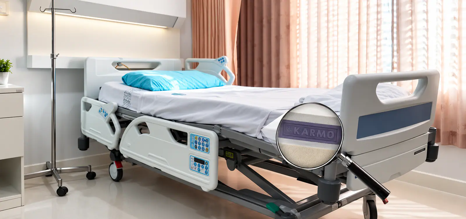 A Karmo navy mattress on a hospital bed, a magnifying glass revealing the KARMO foam inside