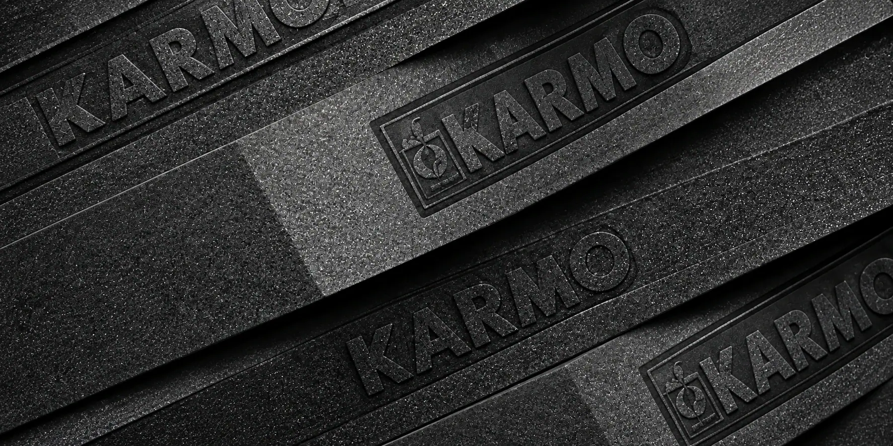 Layers of charcoal Karmo foam embossed with the Karmo mark