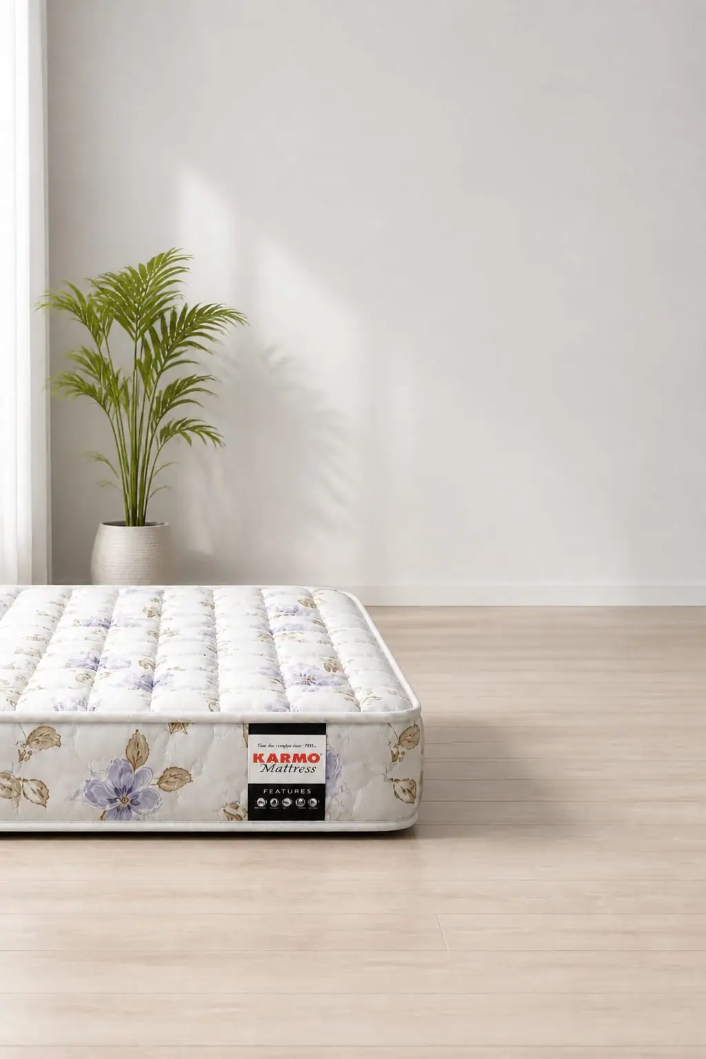A Karmo floral mattress styled in a calm grey bedroom